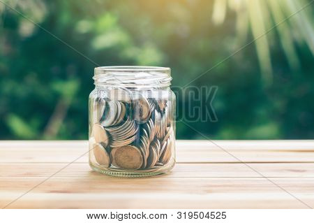Money In A Jar. Money In A Jar Represents For A Saving To Buy A House Or Invest. Planning Savings Mo