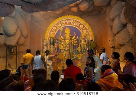 Kolkata, India - October 16, 2018 : Priest Praying To Goddess Durga Using Chamor - A Kind Of Fan, A 