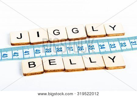 Health Concept Of A Tape Measure Also Showing The Message Jiggly Belly
