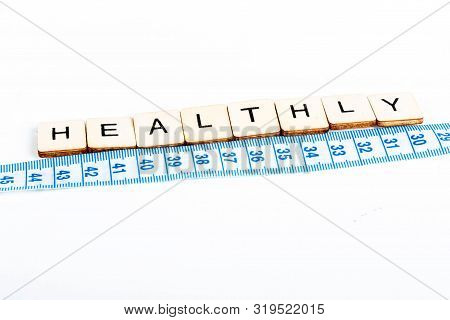 Health Concept Of A Tape Measure Also Showing The Message Healthy