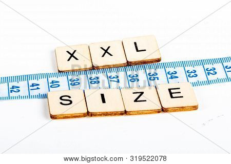 Health Concept Of A Tape Measure Also Showing The Message Xxl Size