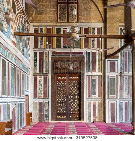 Cairo, Egypt- January 16 2016: Old Colorful Marble Wall With Wooden Door Decorated With Arabesque Or