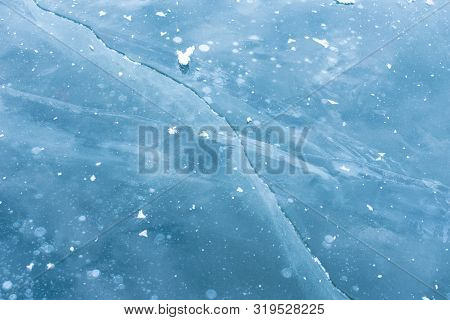 Ice Cracks On Lake Baikal. Crack In The Blue Ice.