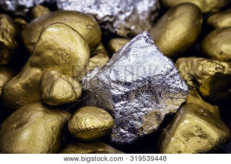 Gold And Silver Nuggets On Black Background. Precious Stones, Luxury Concept And Mineral Drainage. I