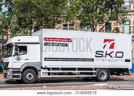 Amsterdam, The Netherlands - June 30, 2019: Large White Transport Truck With Black And Red Lettering