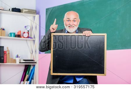 Just Inspired. Exam And Graduation Results. Place For Copy Space. Mature Teacher Man Hold Chalk Boar