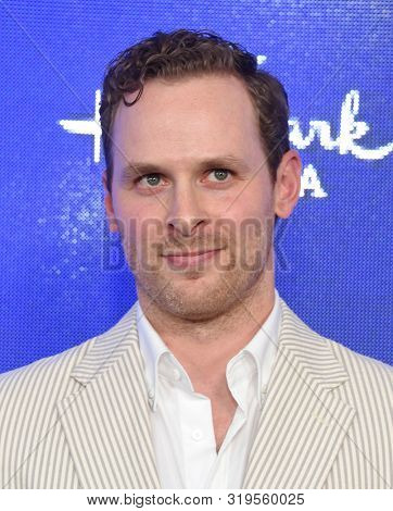LOS ANGELES - JUL 26:  Ben Rosenbaum arrives for the Hallmark Channel and Hallmark Movies & Mysteries Summer 2019 TCA on July 26, 2019 in Los Angeles, CA                