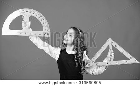 Stem School Disciplines. School Student Learning Geometry. Pupil Girl With Big Rulers. Small Girl Ba