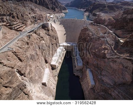 Aerial View Of Hoover Dam, Lake Mead, And Road Leading To Dam, A Snapshot Taken From Bypass Bridge O
