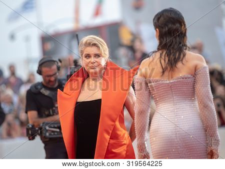 Juliette Binoche and Chaterine Deneuve  walks the red carpet ahead of the Opening Ceremony  during the 76th Venice Film Festival at Sala Grande on August 28, 2019 in Venice, Italy. 