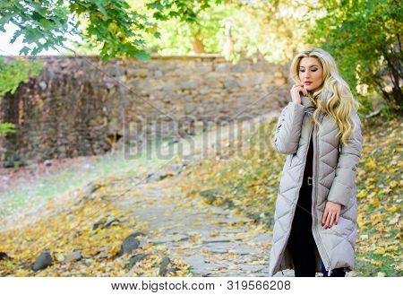 Oversized Jacket Trend. Puffer Jacket Casual And Comfortable Style. Girl Fashionable Blonde Walk In 