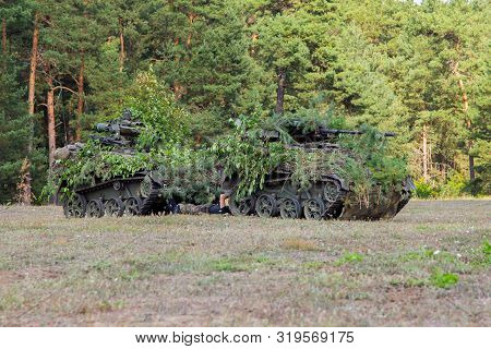 Armoured Weapons Carrier From German Army Stands At Military Training Area