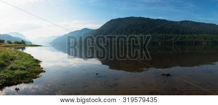 Teletskoye lake in Altai mountains, Siberia, Russia. Beauty panoramic picture in summer morning.