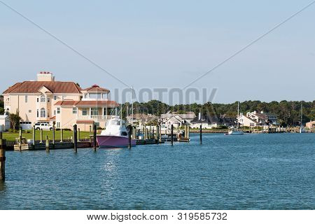 Homes And Boats On Lake Wesley At Rudee Inlet In Virginia Beach, Virginia.