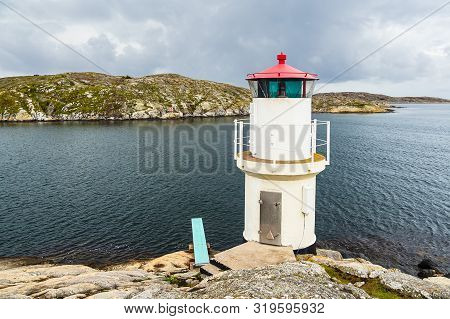 View To A Lighthouse In Molloesund In Sweden.