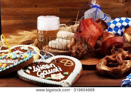 Traditional German Cuisine, Schweinshaxe Roasted Ham Hock. Beer, Pretzels And Various Bavarian Speci