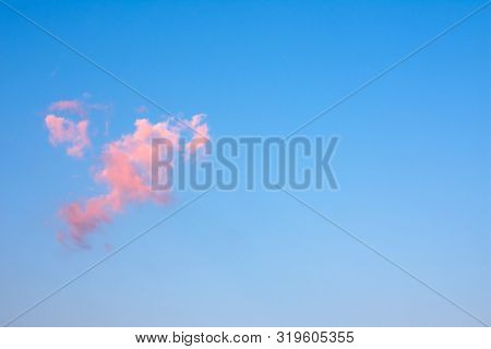 Single Beautiful Pink Cloud In Sky. Copy Space.