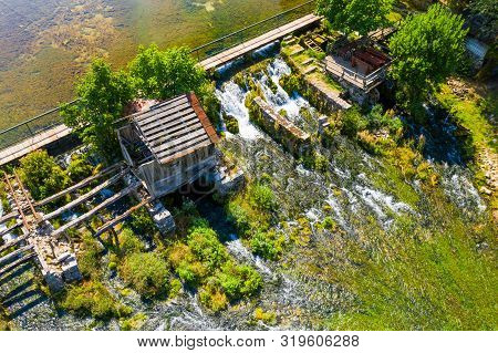 Tonkovic Vrilo, River Source Of Gacka And Wooden Bridge Over The River, Aerial View, Lika Region Of 