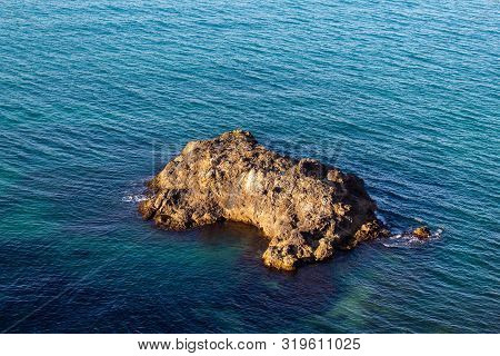 Exotic Rock In The Middle Of The Blue Sea
