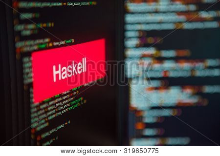 Programming Language, Haskell Inscription On The Background Of Computer Code. Modern Digital Technol