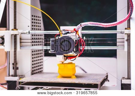 3d Printer In  Work. Making A Plastic Toy On A 3d Printer