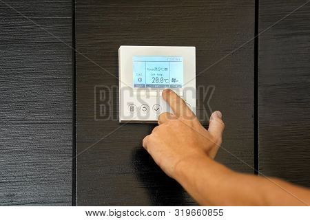 Male Hand Try To Turn On The New Air Condition In Room, In The Hotel Room. Caucasian Man Hands On Th