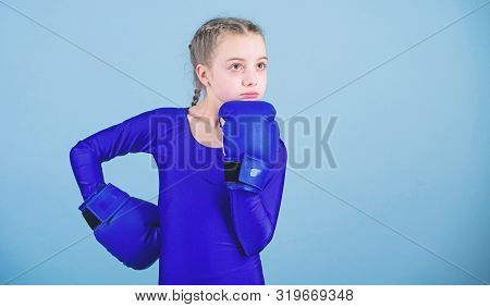 Contrary To Stereotype. Boxer Child In Boxing Gloves. Female Boxer Change Attitudes Within Sport. Ri