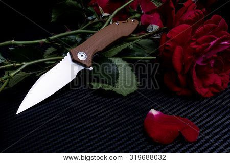 Elegant Beautiful Knife And A Bouquet Of Roses.