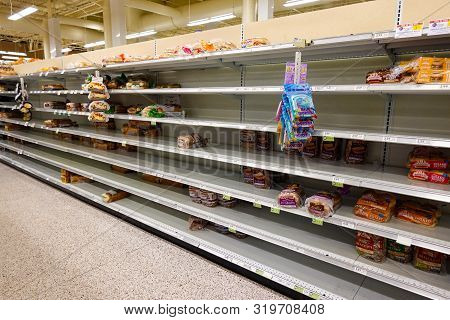 Orlando,fl/usa-8/30/19: Empty Grocery Store Shelves Of Bread Before A Hurricane Or Snow Storm.