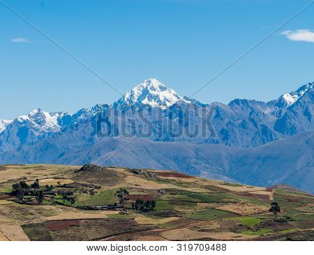Sacred Valley, Peru - 05/21/2019: The Inescapable Snow Peaked Andes Mountains In The Sacred Valley O