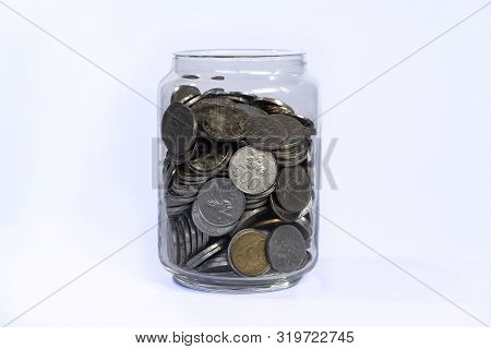 Saving Idr Coins In The Glass Bottle Jar For Finance Investment Or Charity