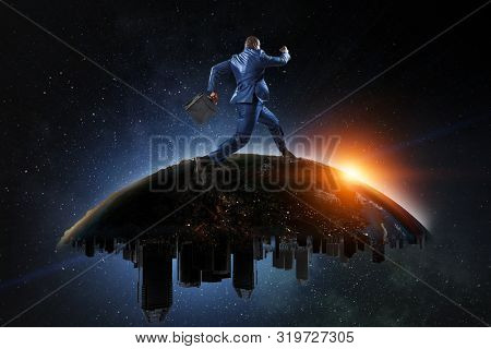 Back view of a black businessman running on the Globe with city scyscrapers on the starry space background