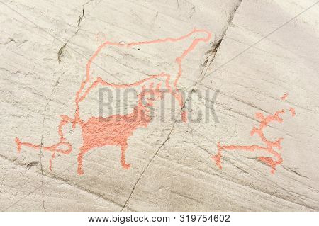 Rock Art In Alta Fjord, Norway. Ancient Symbols, Real Drawing,  Texture In Stone. Red Ocher Paint. H