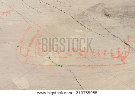 Rock Art In Alta Fjord, Norway. Ancient Symbols, Real Drawing,  Texture In Stone. Red Ocher Paint. H