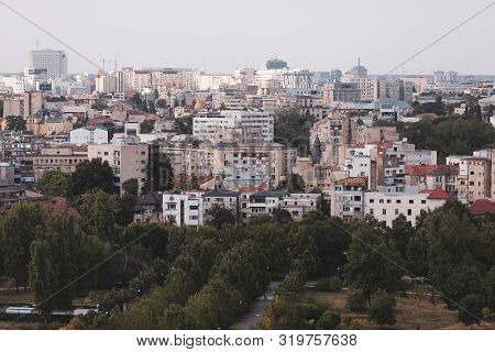 Cityscape Of Old Part Of Bucharest, With Many Worn Out Buildings, As Seen From The Palace Of Parliam
