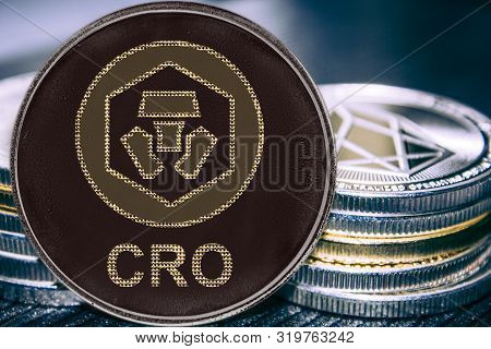 Coin Cryptocurrency Crypto Chain Com Cro On The Background Of A Stack Of Coins.
