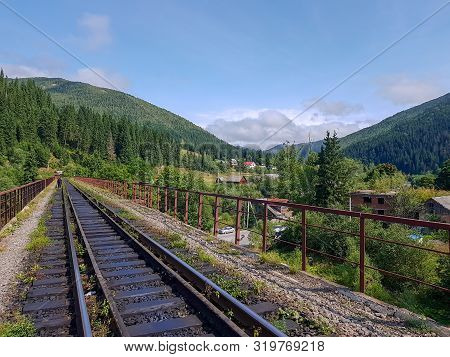 Beautiful Mountain Narrow-gauge Railway Road, Rails In The Mountains Of The Carpathians Passing Thro