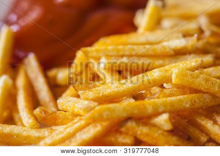 Closeup Of French Fries Corn Snacks Sticks With Ketchup