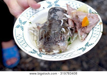 Catfish Head On A Plate. Boiled Catfish In A Plate.