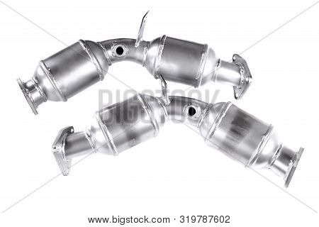 Two Catalytic Converters Isolated Over White Background