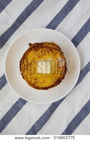Homemade Corn Meal Johnny Cakes With Butter On A White Plate, Top View. Flat Lay, Overhead, From Abo