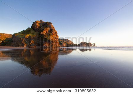Beautiful Sunset At Piha Beach, New Zealand