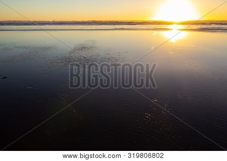 Sunset At Piha Beach, North Island, New Zealand