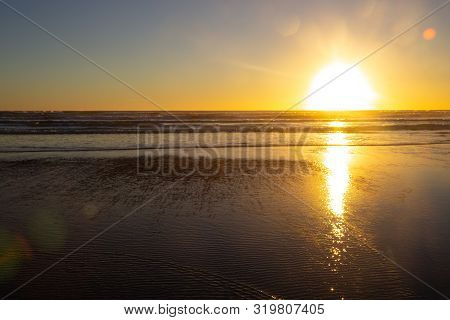 Sunset At Piha Beach, North Island, New Zealand