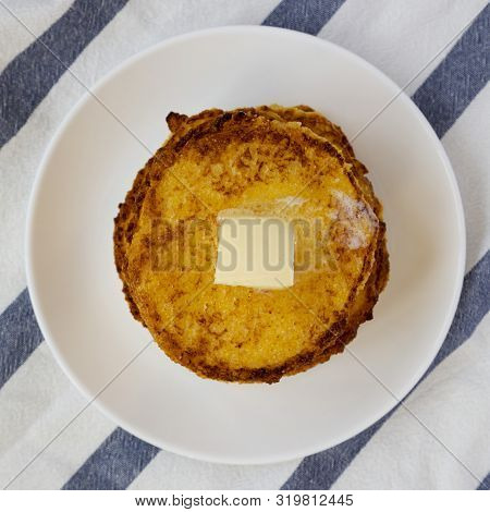 Homemade Corn Meal Johnny Cakes With Butter On A White Plate, View From Above. Flat Lay, Overhead, T