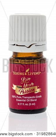 Winneconne, Wi - 28 August 2019 : A Bottle Of Young Living Live Your Passion Oil On An Isolated Back