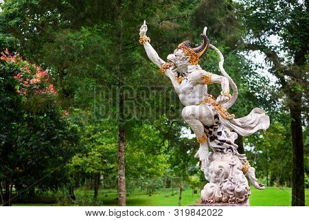 Ancient Statue Of Fighting Hanuman From Epic Hindu Legend Ramayana In Bedugul Botanical Garden. Trad