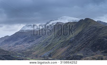 Stunning Landscape Image Of Dinorwig Slate Mine And Snowcapped Snowdon Mountain In Background During