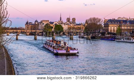 Touristic Boat, The Oldest Bridge ( Pont Neuf ) Across Seine River And Historic Buildings Of Paris F