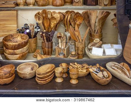 Lots Of Wooden Objects At A Market Stall
